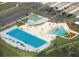 Aerial view of a Gathering-friendly water park with pools, slides, and parking lot at 1352 Raspberry Dr, North Port, FL 34289