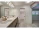 Spacious bathroom featuring a dual sink vanity, modern fixtures, and updated finishes at 1425 Appian Dr, Punta Gorda, FL 33950