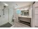 Contemporary bathroom featuring a walk-in shower and a double sink vanity at 1425 Appian Dr, Punta Gorda, FL 33950