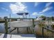 A private boat lift showcases waterfront living and easy access to boating and water activities at 1425 Appian Dr, Punta Gorda, FL 33950