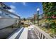 Private dock with a boat lift, bench seating, and landscaping, offering tranquil views and waterfront lifestyle at 1425 Appian Dr, Punta Gorda, FL 33950