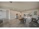 Open-concept living room with tile flooring, neutral decor, and access to the lanai, perfect for entertaining and relaxation at 1425 Appian Dr, Punta Gorda, FL 33950