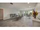 Comfortable living room featuring tile floors, neutral colors, and ample natural light, creating a cozy and inviting space at 1425 Appian Dr, Punta Gorda, FL 33950