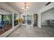 Bright living space with large windows offering a view of the tropical outdoor area at 1425 Appian Dr, Punta Gorda, FL 33950