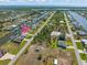 Aerial view of a home located on a canal, marked with a pin for easy location at 15618 Aqua Cir, Port Charlotte, FL 33981