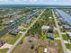 Wide aerial view of a community with homes located on canals, close to the ocean at 15618 Aqua Cir, Port Charlotte, FL 33981
