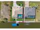 Aerial view of home with a private boat dock and screened-in pool. Property line displayed at 15618 Aqua Cir, Port Charlotte, FL 33981