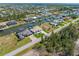 Expansive aerial shot showcasing the waterfront homes along a canal in a residential community at 15618 Aqua Cir, Port Charlotte, FL 33981
