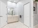 Bathroom featuring vanity, large mirror, ample cabinet space and easy access to amenities at 15618 Aqua Cir, Port Charlotte, FL 33981