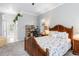 Comfortable bedroom with a wooden bed frame and a built in work space at 15618 Aqua Cir, Port Charlotte, FL 33981