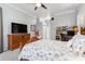 Relaxing bedroom with a large flat screen TV and a wooden dresser at 15618 Aqua Cir, Port Charlotte, FL 33981