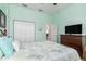 Relaxing bedroom with light green walls, closet and dresser. Plenty of space for rest and relaxation at 15618 Aqua Cir, Port Charlotte, FL 33981