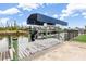 Boat dock with a covered lift, and boat ready for the water at 15618 Aqua Cir, Port Charlotte, FL 33981