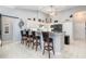 Stylish kitchen with breakfast bar, stainless steel appliances, white cabinets, and granite countertops at 15618 Aqua Cir, Port Charlotte, FL 33981