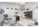 Bright kitchen features granite counters, white cabinets, stainless appliances, and a ceiling fan at 15618 Aqua Cir, Port Charlotte, FL 33981