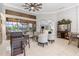 Open living space with tiled floors, high ceilings, wet bar, and access to the outdoor patio at 15618 Aqua Cir, Port Charlotte, FL 33981