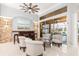 Comfortable seating area with tiled floors, high ceilings, wet bar, and backyard views at 15618 Aqua Cir, Port Charlotte, FL 33981