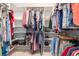Spacious walk-in closet with built-in shelving and hanging racks at 15618 Aqua Cir, Port Charlotte, FL 33981