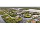 Aerial view of the property with water access and mature trees at 17342 Foremost Ln, Port Charlotte, FL 33948