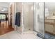 Well-lit bathroom featuring tiled floor, a stand-up shower, and a vanity with cabinet storage at 17342 Foremost Ln, Port Charlotte, FL 33948
