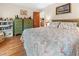 Cozy bedroom with a comfortable bed, hardwood floors, and ample storage with stylish dressers at 17342 Foremost Ln, Port Charlotte, FL 33948