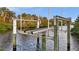 View of the canal showing a well-maintained boat lift, providing easy access to the water at 17342 Foremost Ln, Port Charlotte, FL 33948