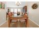 Elegant dining room featuring a glass-top table, comfortable seating, and tasteful decor at 17342 Foremost Ln, Port Charlotte, FL 33948