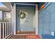 Welcoming front porch with double doors, charming decor, and a cheerful welcome mat at 17342 Foremost Ln, Port Charlotte, FL 33948