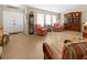 Inviting living room featuring tile flooring, ample natural light, and comfortable seating arrangements at 17342 Foremost Ln, Port Charlotte, FL 33948
