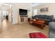 Comfortable living room featuring neutral walls, tile flooring, and a cozy gray sofa at 17342 Foremost Ln, Port Charlotte, FL 33948