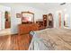 Primary bedroom boasting hardwood floors and dresser with decor at 17342 Foremost Ln, Port Charlotte, FL 33948