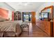Hardwood floors in main bedroom lead to doors to a patio and pool at 17342 Foremost Ln, Port Charlotte, FL 33948