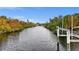 Scenic water view of the canal with lush greenery on both shorelines from the property at 17342 Foremost Ln, Port Charlotte, FL 33948