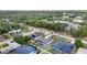 Aerial shot of cozy homes featuring screened-in pools, solar panels and verdant surroundings at 18379 Edgewater Dr, Port Charlotte, FL 33948