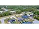 Overhead view of residences with private pools, solar panels, and well-maintained yards at 18379 Edgewater Dr, Port Charlotte, FL 33948