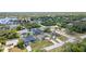 Ariel view of homes shows the neighborhood with lush landscaping and nearby waterways at 18379 Edgewater Dr, Port Charlotte, FL 33948