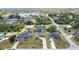 Aerial view of homes shows the neighborhood's layout with lush landscaping and nearby waterways at 18379 Edgewater Dr, Port Charlotte, FL 33948