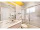 Clean bathroom with shower and tub combo, and vanity with mirror, toilet, and fixtures at 18379 Edgewater Dr, Port Charlotte, FL 33948
