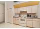 Kitchen featuring matching appliances, countertops, and cabinets, and a convenient pantry closet at 18379 Edgewater Dr, Port Charlotte, FL 33948
