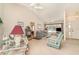 Bright living room with vaulted ceiling, neutral carpet, comfortable seating, and views of the front entryway at 18379 Edgewater Dr, Port Charlotte, FL 33948