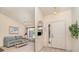 Inviting living room featuring tile entryway, vaulted ceilings, and views into a cozy adjacent living area at 18379 Edgewater Dr, Port Charlotte, FL 33948