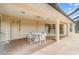 Relaxing covered patio features a table with four chairs perfect for outdoor entertaining at 18379 Edgewater Dr, Port Charlotte, FL 33948