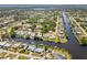 Aerial view of a waterfront neighborhood with canals and easy access to the open bay at 18446 Burkholder Cir, Port Charlotte, FL 33948