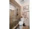 Bathroom features a glass shower with pebble flooring and decorative hardware at 18446 Burkholder Cir, Port Charlotte, FL 33948