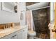 Bathroom features dark tile shower with granite countertops and flooring at 18446 Burkholder Cir, Port Charlotte, FL 33948