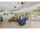 Cozy living room with tile floors, comfortable seating, and views of the canal at 18446 Burkholder Cir, Port Charlotte, FL 33948