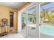 View from inside to backyard with pool, patio and screened in porch at 18446 Burkholder Cir, Port Charlotte, FL 33948