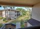 Balcony view overlooking landscaped grounds and neighboring buildings at 19505 Quesada Ave # Ee202, Port Charlotte, FL 33948