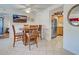 Dining area open to kitchen, featuring a dining table with seating at 19505 Quesada Ave # Ee202, Port Charlotte, FL 33948