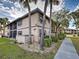 Condo exterior showcasing well-maintained landscaping and architectural details at 19505 Quesada Ave # Ee202, Port Charlotte, FL 33948